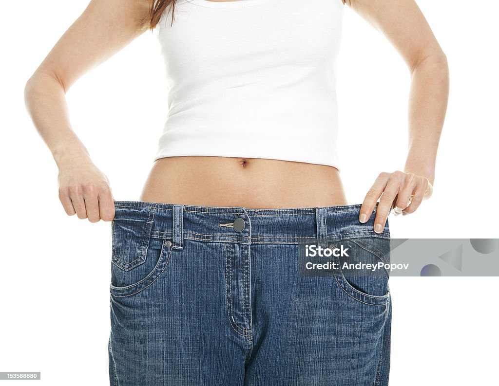 jeans Slim donna tirando oversize - Foto stock royalty-free di Abbigliamento