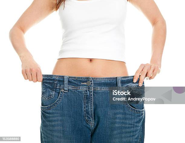 Jeans Slim Donna Tirando Oversize - Fotografie stock e altre immagini di Abbigliamento - Abbigliamento, Abbigliamento casual, Addome