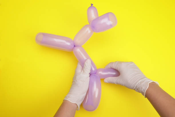 istock Hands making a dog from a balloon 1535897818