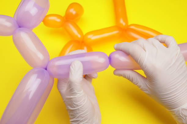 istock Hands making a dog from a balloon 1535900412