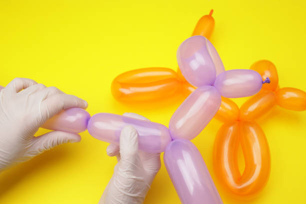 istock Hands making a dog from a balloon 1535900414