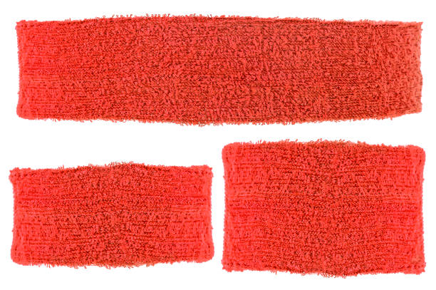 Red cotton training headband and wristbands isolated on a white background. Sport equipment. Red cotton training headband and wristbands isolated on a white background. Sport equipment. sweat band stock pictures, royalty-free photos & images