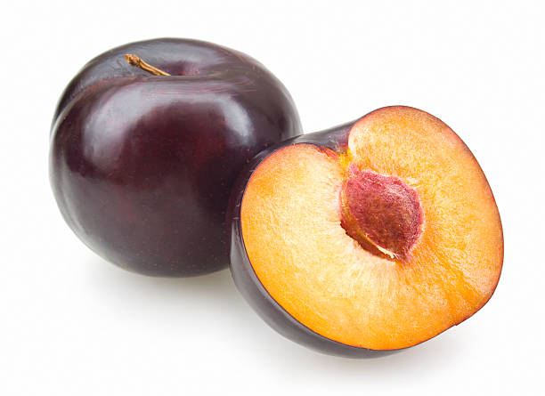 black plums black plums isolated on white background plum stock pictures, royalty-free photos & images