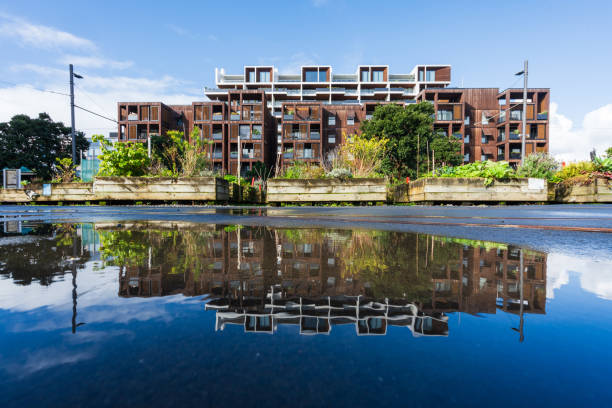 istock Modern apartment buildings reflecting in water. 1535913289