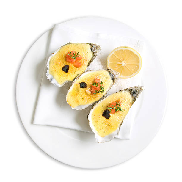 istock oysters with sauce and lemon on white 153591469