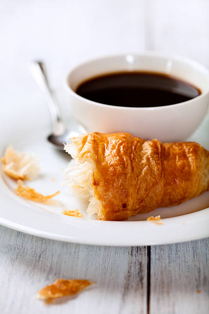 istock Croissant and a cup of black coffee 153591583