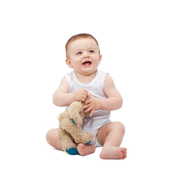 istock Baby boy holding teddy bear 153591630