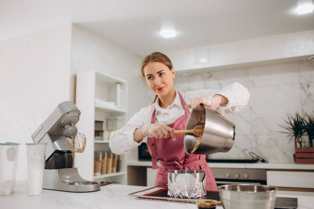 istock a woman is preparing cheesecake in the kitchen 1535918164