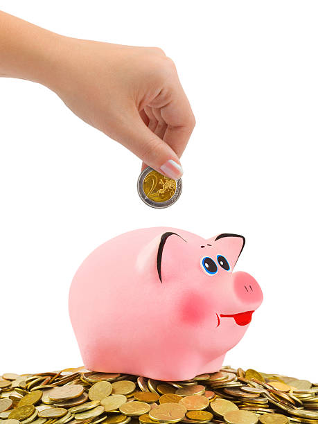 istock Piggy bank and hand with coin 153592632