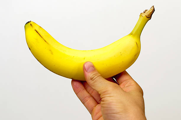 istock Right Hand holding a banana 153593353