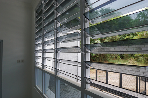 Jalousie windows, sometimes called awning windows, are composed of glass set parallel in a frame.