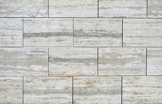 Travertine stone tiles, cladding wall for exterior. Background and texture.