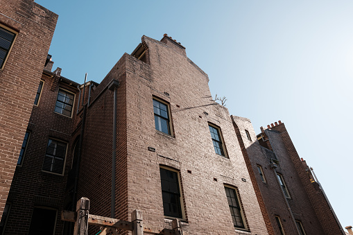 Old retro styled building detail with blue sky.