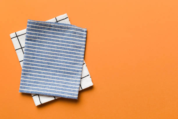 istock top view with blue kitchen napkin isolated on table background. Folded cloth for mockup with copy space, Flat lay. Minimal style 1536068823