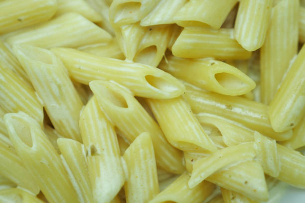 homemade cooked pasta in a plate on table .