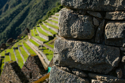 Wonder of the World Machu Picchu in Peru. Beautiful landscape in Andes Mountains with Incan sacred city ruins.