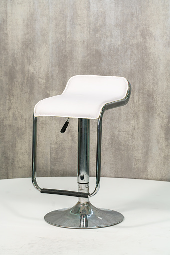 White modern bar chair isolated on gray background