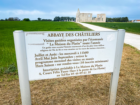 Sign detailing the guided tours of the ruins of the Cistercian Abbey of Notre-Dame-de-Ré in La Flotte, France