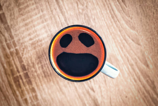 istock Coffee cup with funny screaming in fear face, pareidolia effect. Shocked, stressed, angry, scared and furious coffee, top view 1536168603