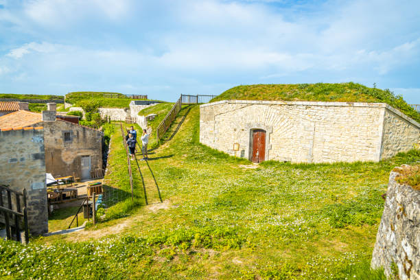 Tourists visiting the old site of Fort la Prée in La Flotte Tourists visiting the old site of Fort la Prée in La Flotte, France flotte stock pictures, royalty-free photos & images