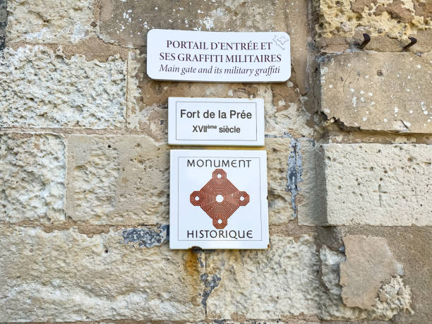 Fort de la Prée sign on the main gate of the fortress in La Flotte Fort de la Prée sign on the main gate of the fortress in La Flotte, France flotte stock pictures, royalty-free photos & images