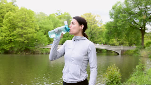 Woman hydrating after having exercise done