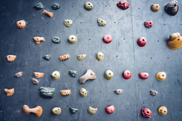 istock Artificial climbing wall with colorful grips and ropes 1536222644