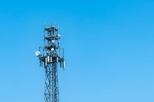 istock Broadcast tower 5G with satellite dishes against the blue sky. 1536235606