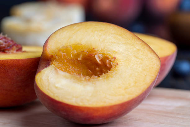 istock Ripe fresh peaches on a wooden table 1536235666