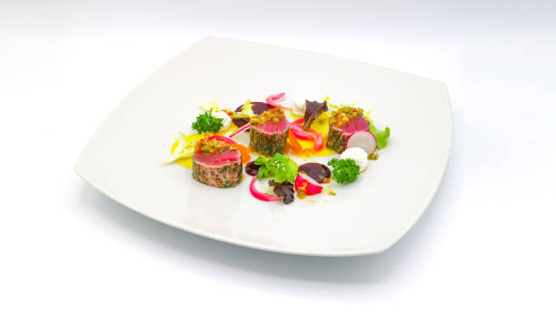 istock Raw and cooked tuna dish with vegetables 1536236027
