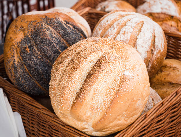 cob loaves on display.  artisan market. english stately home - wheat whole wheat close up corn on the cob imagens e fotografias de stock