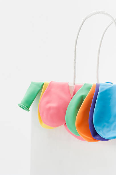 istock White paper bag with balloons 153628380