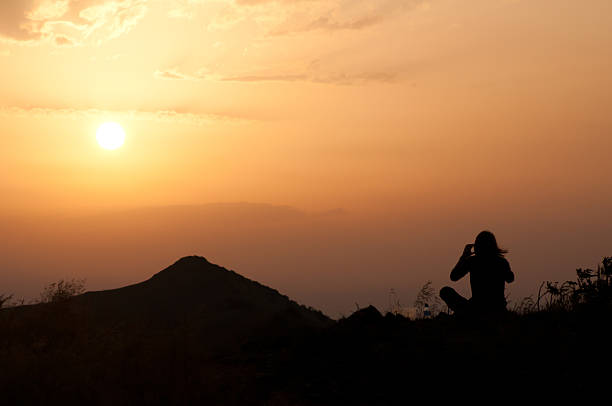 istock Woman viewing the sunset 153631142