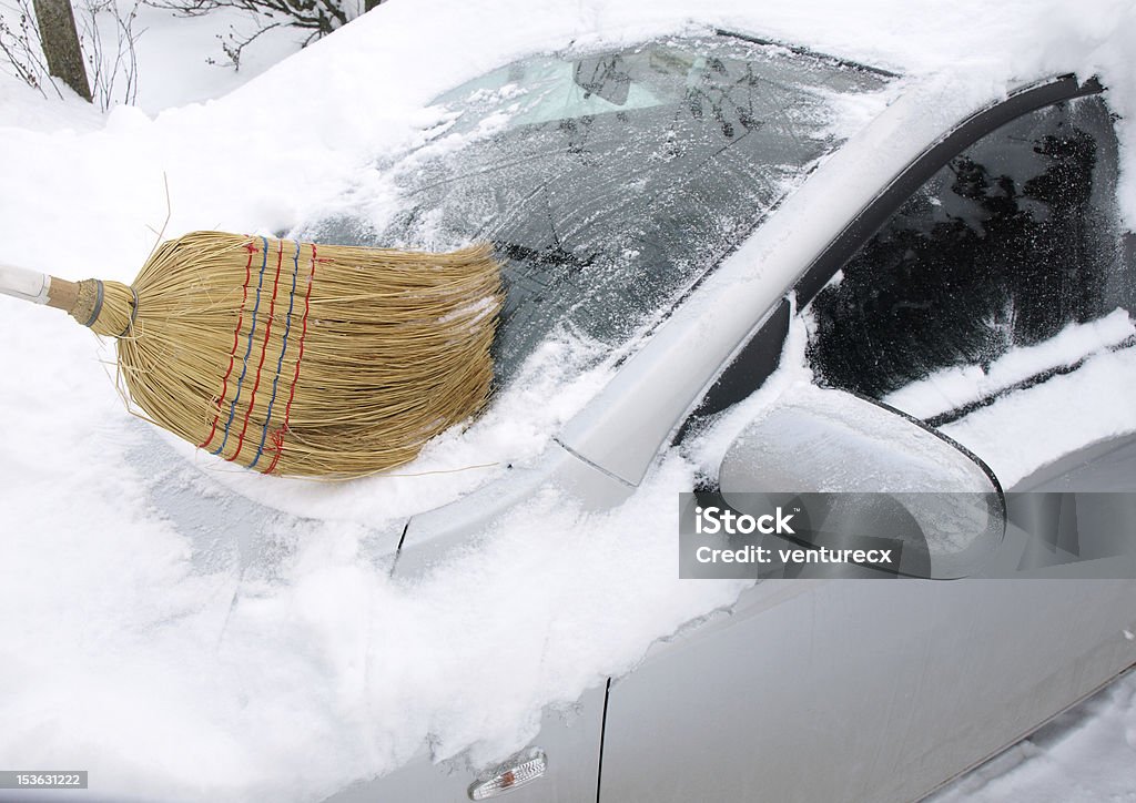 Removing snow from car Car Stock Photo