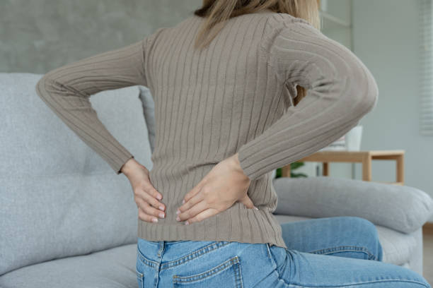 istock woman holding her lower back while and suffer from unbearable pain health and problems, chronic back pain, backache in office syndrome, scoliosis, herniated disc, muscle inflammation 1536335765