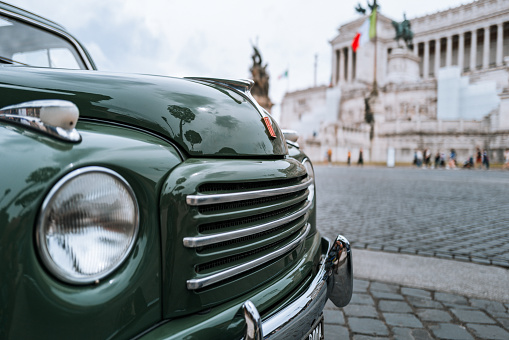 Rome, Italy, June 4, 2023: Vintage car parade on June 4, 2023 in Roma, Italy. Old vintage cars are parked in front of Vittorio Emanuele Monument, participating to a parade