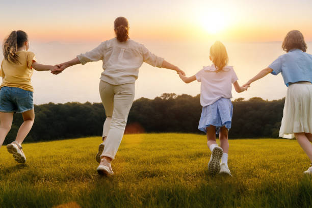 istock Happy family at sunset 1536364446