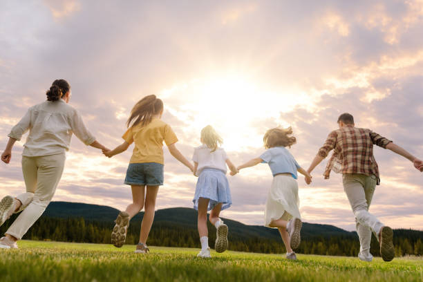 istock Happy family at sunset 1536365486
