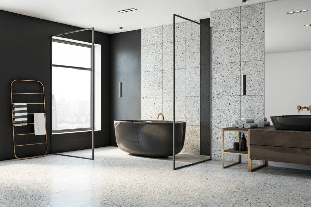 istock Perspective view of modern loft bathroom interior design with stone grey floor, black and stone walls and window with city view. 3D Rendering 1536365493