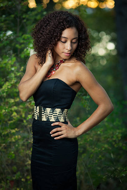 istock Young woman outdoors with contemplative expression. 153636888