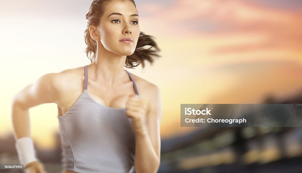 girl in sport girl in sport on the sunset background One Woman Only Stock Photo