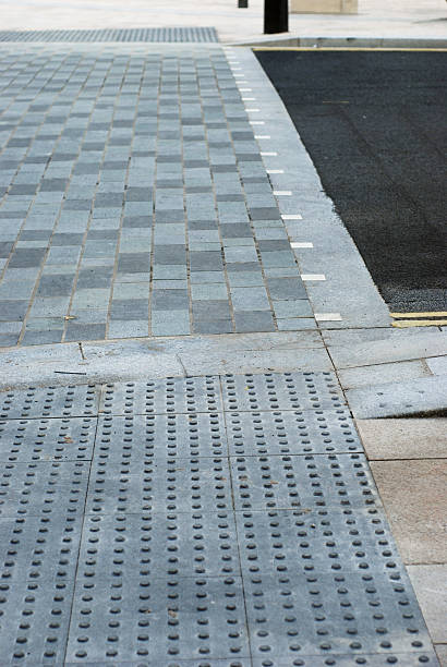 istock Crossing road with blind friendly sidewalk 153639397