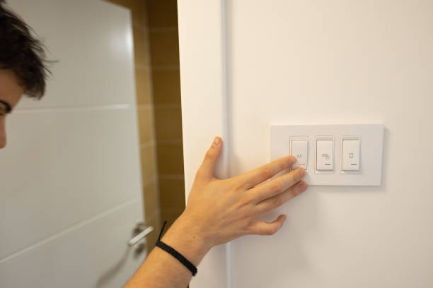 istock Unrecognizable teenage boy, turn on the light switch for the bathroom 1536397555
