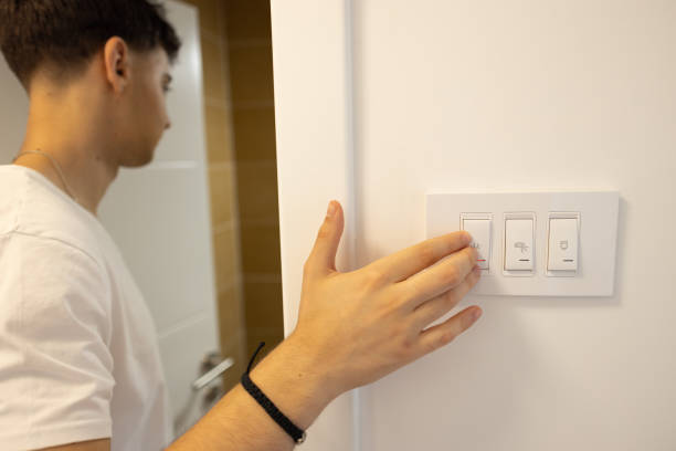 istock Unrecognizable teenage boy, turn on the light switch for the bathroom 1536398076