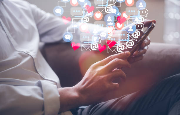 istock Man using online entertainment mobile applications surfing social media searching internet.Social media and digital online concept, man using smart phone. The concept of living on vacation 1536409189
