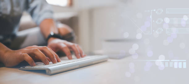 istock man typing on wireless keyboard, sitting on couch at home, working form home concept, work online and communication, sending reading email, copy space 1536410760