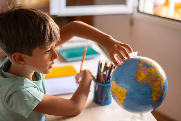 istock Beautiful School Boy, Studying At Home. 1536424560