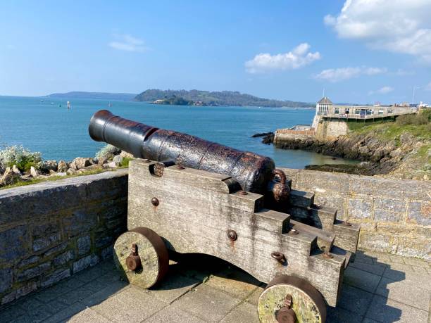 Ancient cannons pointing out to sea at Plymouth in Devon