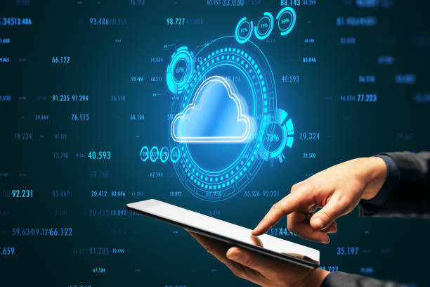 istock Close up of businessman hand using cellphone with modern cloud computing hologram with index on blue background. Connectivity technology concept. 1536460007