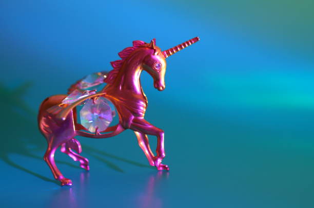 istock Metal unicorn figurine on a blue background. 1536460214